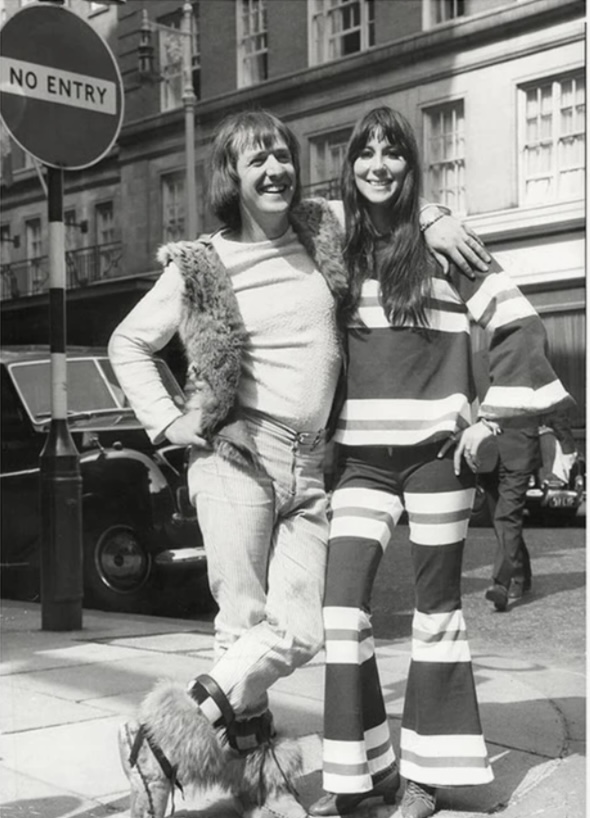 cher's tweet image. SORRY🌞SON,HAPPY
🎂DAY.
 
    S&amp;amp;C
“THE BEGINNING.”
OUR FIRST DAY IN LONDON.KICKED OUT OF LONDON HILTON,ON FRONT OF NEWSPAPER,
4 DAYS LATER WE WERE ON TOP OF THE 🌏.
WE WERE WEARING OUR FAVORITE CLOTHES.
MINE WAS RED WHITE &amp;amp; BLUE. MY MOM SAVED IT
Son,..We both lost our baby fat💋