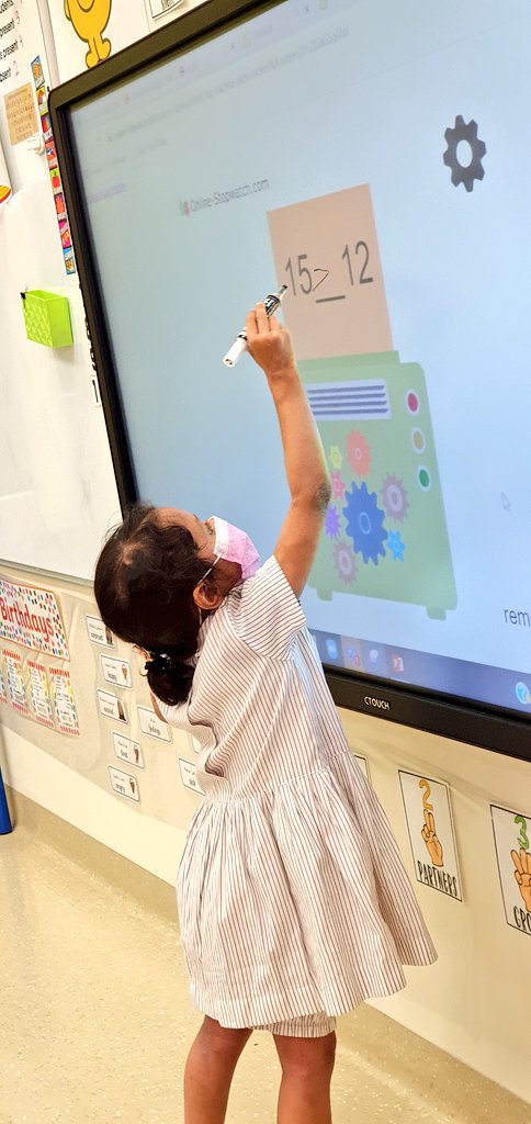 StaceyJudith's tweet photo. Working to solve maths problems through fun #ICTGames on our @CTOUCH_displays IWBs makes learning so much fun!🤩 Here we're using a cog machine to practice the concept of 'Greater &amp; Less Than' the given number with the symbols #Kg1AHappyHorses🏇 @NMSKindergarten @gemsnms_alkhail https://t.co/oNnJCrd8JH