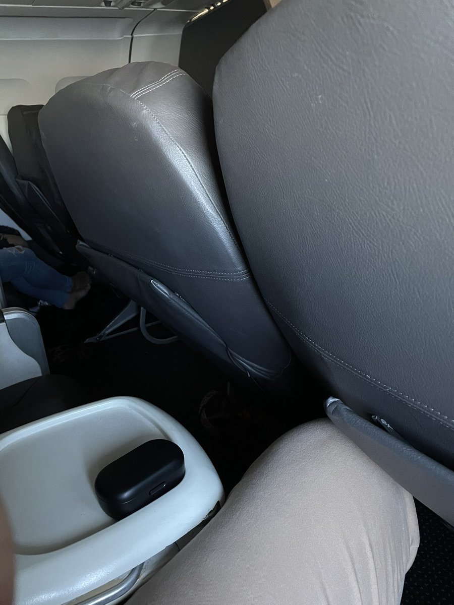 JPicozzi88's tweet photo. @americanair This is my view from seat 2F on AA1703 this morning. With the joker in front of me reclined, I’m pretty sure I would have had more room in coach if I denied my auto upgrade.   Would I even have enough room to exit my seat in an emergency?  How is this ok? https://t.co/qvby0KRAdE