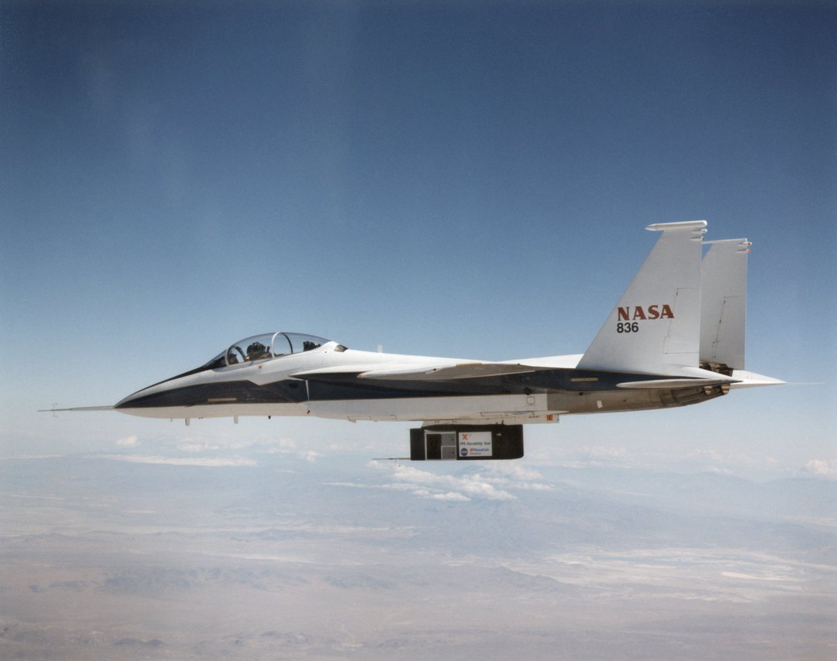 The F-15 is used as a testbed to this day by mounting a variety of payloads to its hardpoints. In this image, it's testing the X-33's Thermal Protection System