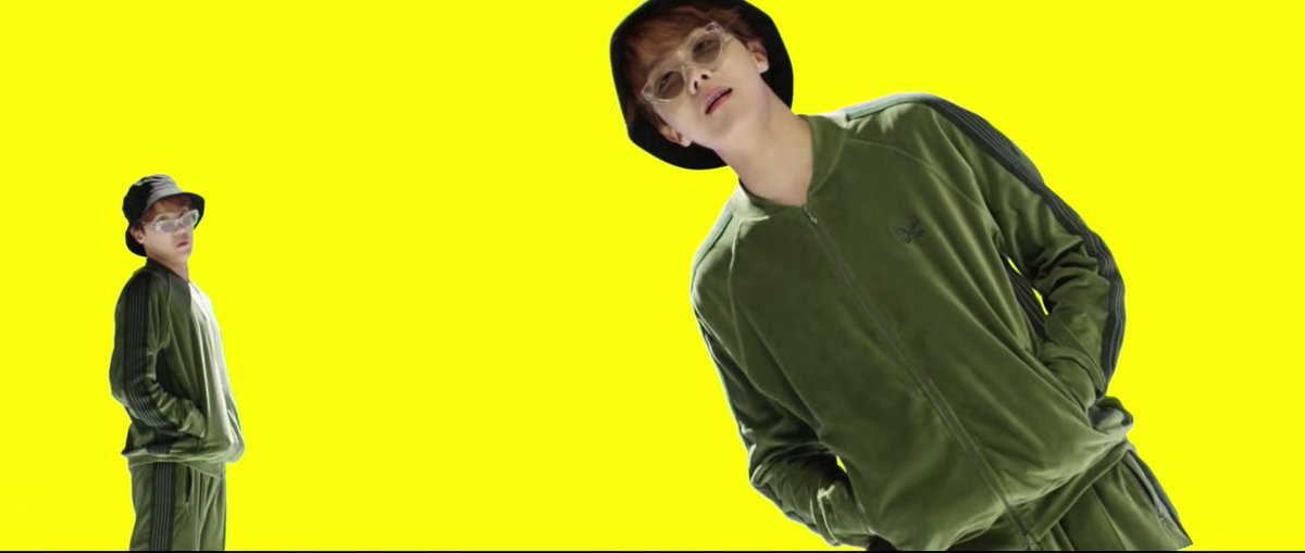 i am first going to talk about how this theme connects to the colors of the music video. the music video is filled to the brim with bright hues with solid backdrops, fun props, and colorful clothing. but the most important colors are the colors of the room hobi is in