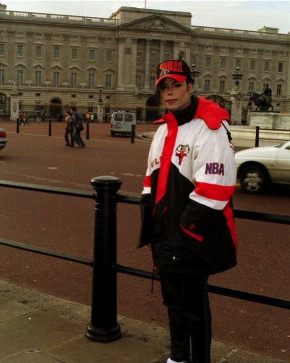 A Michael Jackson impersonator standing outside Buckingham Palace, December, 1996.