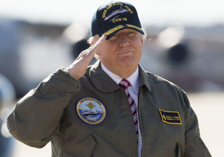 erichenley's tweet photo. @gregkellyusa Yeah, I'm sure Trump would never wear military hats or jackets with patches on them either, right?

Spoiler alert: you're an idiot. https://t.co/xFY3KIB7DA