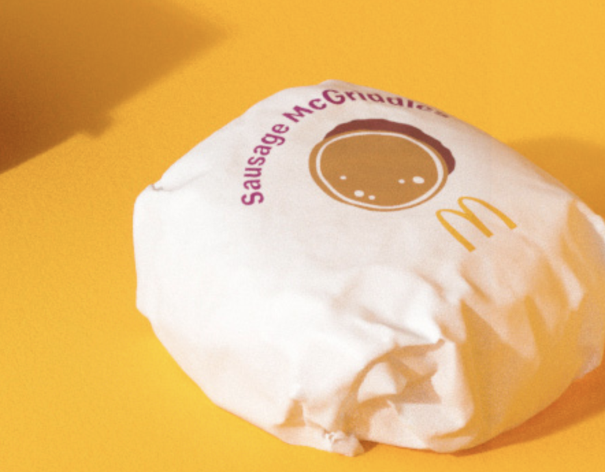this sausage mcgriddle illustration that’s almost tucked out of view is... strange. they can’t use the side profile of a sausage, because that implies hot dogs. none of the other illustrations really have any 3d layering/depth or detail so this doesn’t feel cohesive or consistent