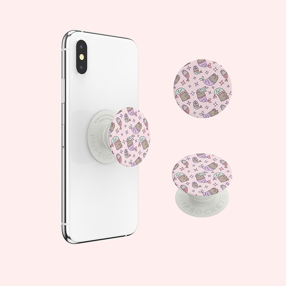 Pusheen's tweet photo. With these new #Pusheen #PopSocket #PopGrips, it's easy to swap out for another #Pusheen top when it's time for a change! ๐งโโ๏ธ https://t.co/9ACMvSpSgJ https://t.co/tD8Zo9Al1z
