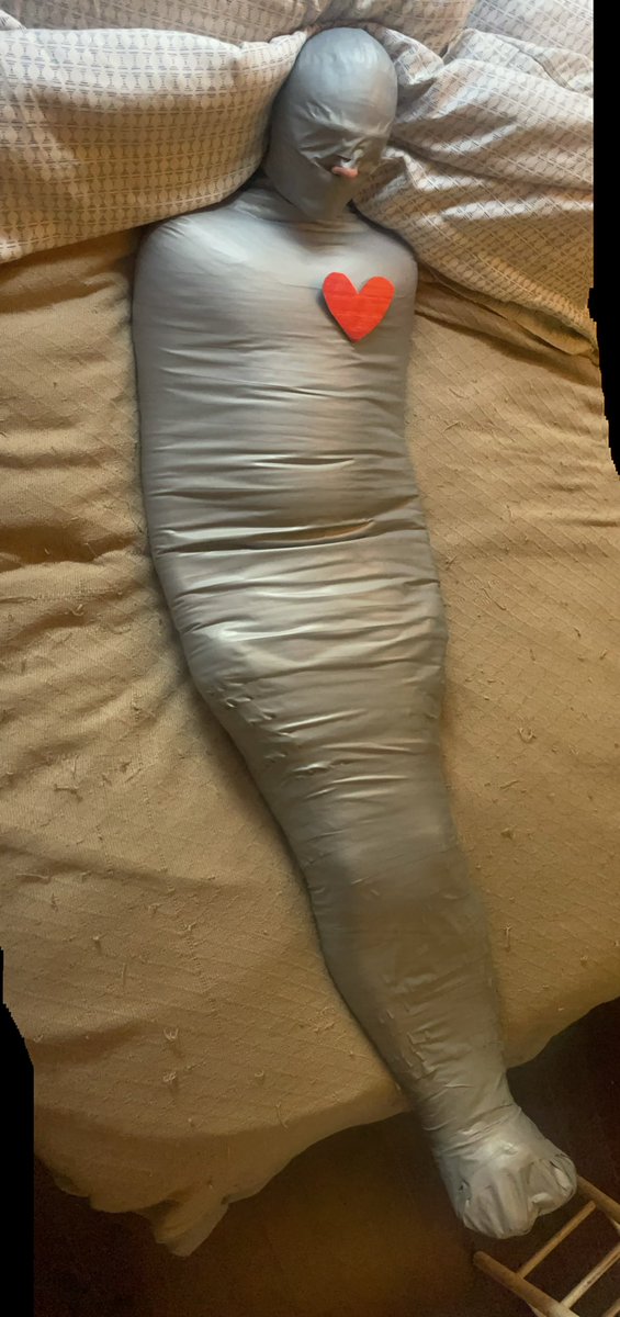 MasterMummy007's tweet photo. TinMan found his heart. #mummification #mummificationbondage #mummified #pvcmummification #wrappedheadtotoe #Domscangettiedtoo https://t.co/ZHzI1rayVl