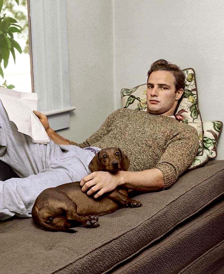 Marlon Brando and his dachshund at his grandmother's house in California, 1949.