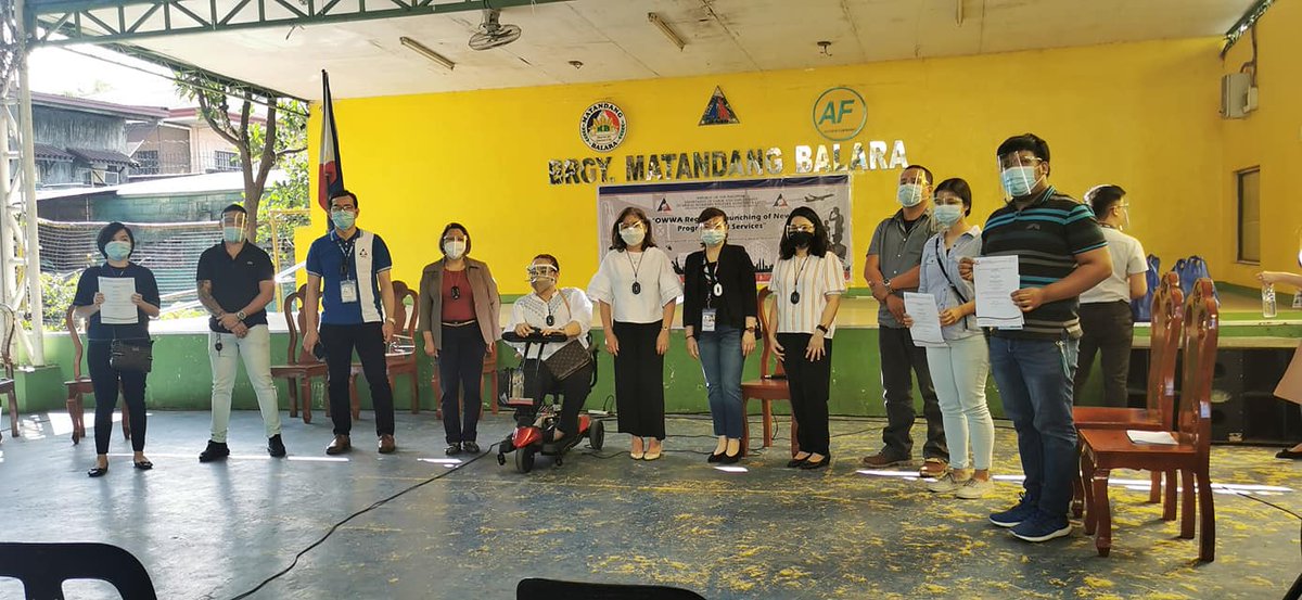 OWWA Director Atty. Edelyn A. Dungan-Claustro, NCR Director Ma.Teresa B. Capa and OIC of Internal Audit Carmelita T. Raquiza award the certificates of TABANG OFW program to beneficiaries during the OWWA Regional Launching of Programs and Services at Matandang Balara, Quezon City.