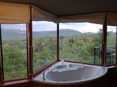 Thabela Thabeng Mountain Retreat and Hiking is a breakaway resort situated in the Vrdefort Dome on the banks of the Vaal. Offers rafting, paddling, abseiling, riverboat cruising, fly-fishing, hiking, game-viewing, and birding.

thabelathabeng.co.za