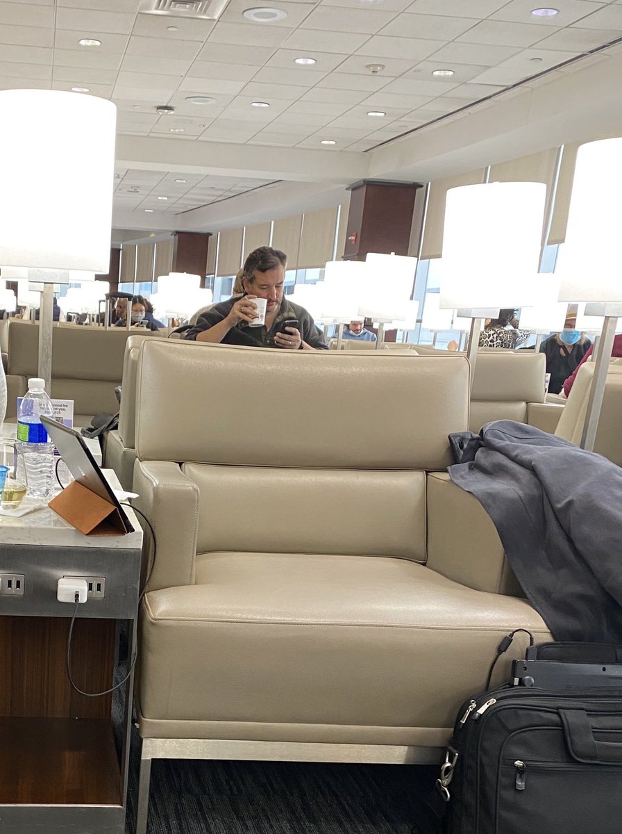 There's also a second picture, seemingly from a totally different source, of an unmasked man who looks like Cruz, wearing the same pullover, sitting in an airport lounge. That person's ring and Fitbit are also consistent with what Cruz always wears, for what it's worth.