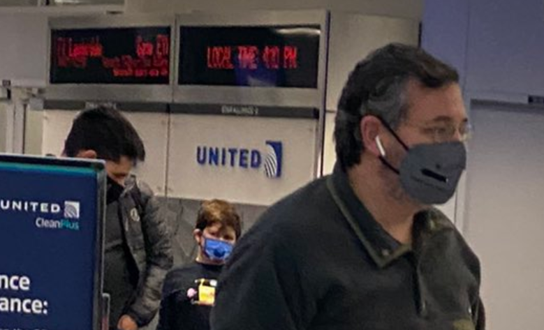 Second question: when was the picture taken? We can say assume it was taken within the last few months, because of masks and winter clothing. The gate information in the background (IAH -> ILL at E11) would have only been correct two days since Nov. 1: Dec. 26 and yesterday.