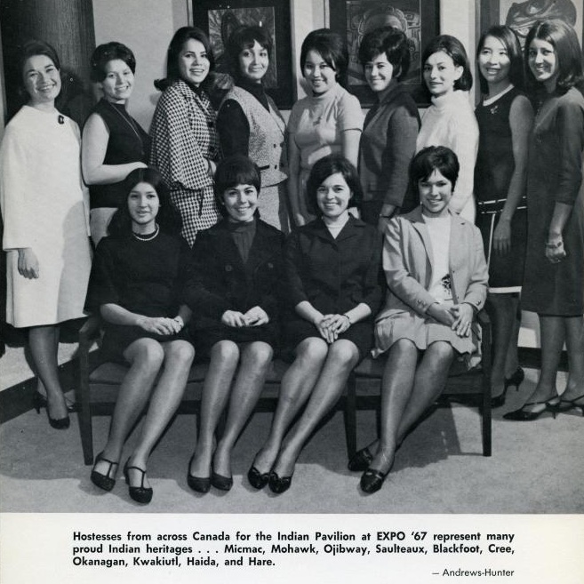 A black and white photo of 13 of the young Indigenous hostesses from across Canada for the Indian Pavilion at EXPO '67. Nine stand in the back row and four are seated in the front row. photo credit: United Church of Canada Pacific Mountain Region Archives