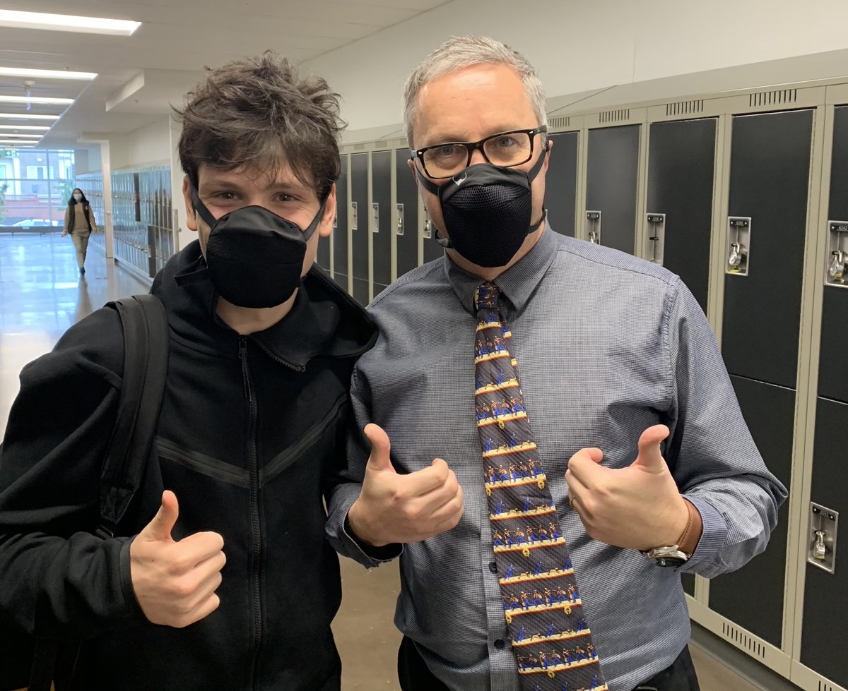johnofly's tweet image. @dropgard Making good use of the mask for my 'game' as a teacher. Students better able to hear me speak more clearly. Always grand to meet @CityOfNorthVan St. Thomas Aquinas' 2021 Grad &amp;amp; @TSSRovers' legend Henry Cromack in the hallway today. Dressed for success 👍👍@WillCromack🏆