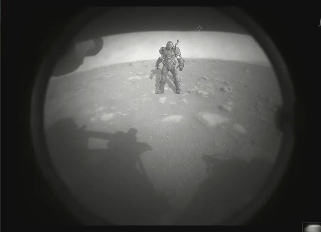 Photo from the NASA Rover Perseverance taken on Mars with DOOM Guy looming in the background