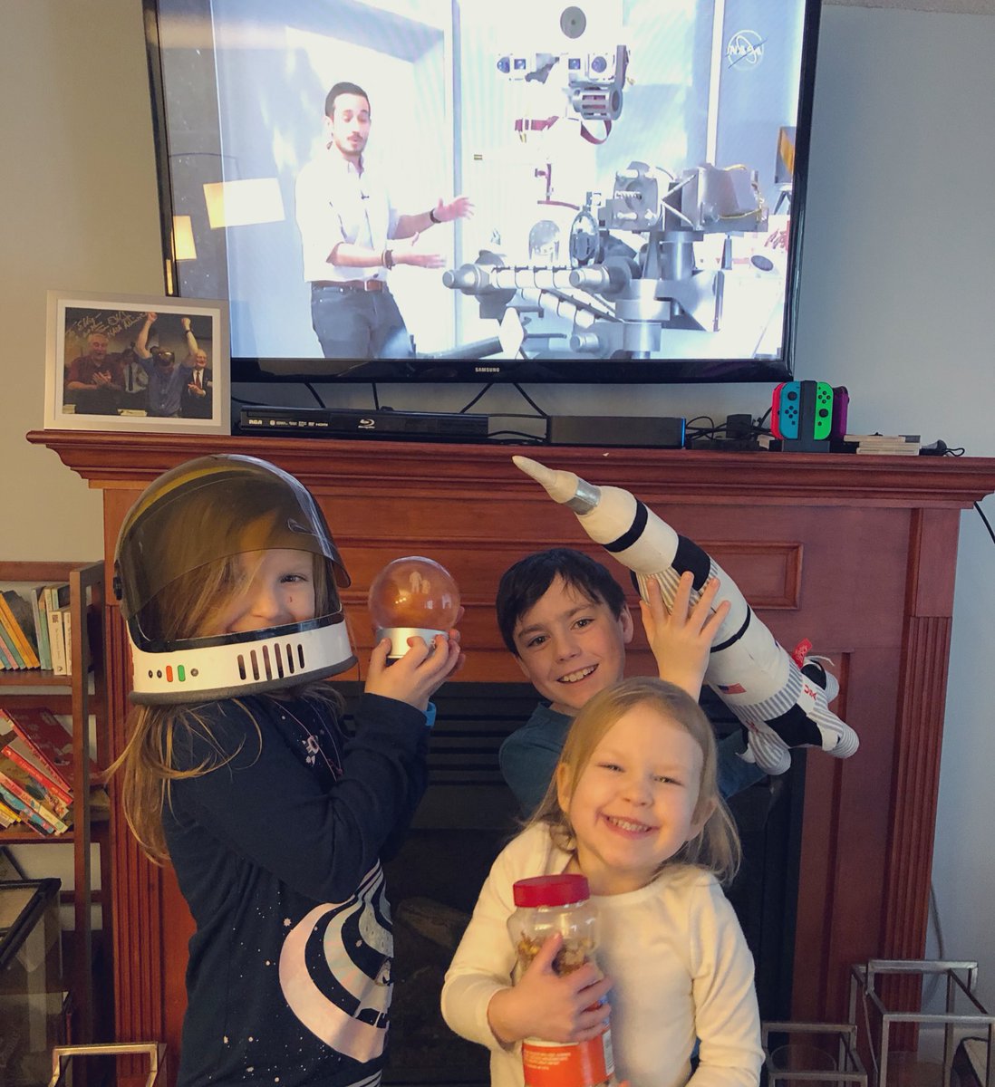 EllieRocksSpace's tweet photo. We have Mars, lucky peanuts, Saturn V and a picture from when Spirit landed! We are go for landing!! #CountdownToMars #Mars2020 #preserverance @NASAJPL https://t.co/DNKF7PpTiZ