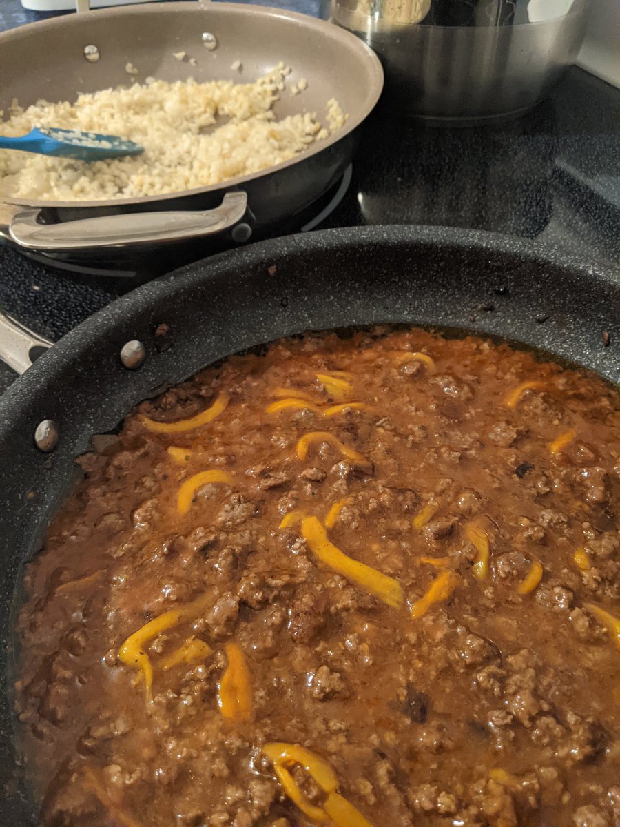 danielhayward's tweet photo. Ethiopian berbere stew on the stove: beef, peppers, tomato sauce and berbere spice are in the near pan, riced cauliflower in the far one. #MyGoodFood https://t.co/Usi0Cg8x5s