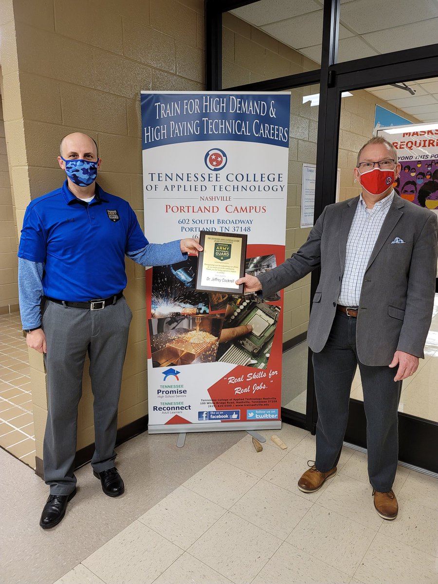 SSG James W. Covey with the TN Army National Guard presenting our campus (Dr. Jeff Cockrell pictured) an Award of Excellence plaque for our assistance to the National Guard.