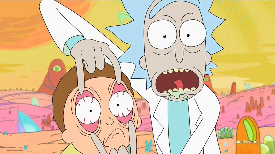 Rick with shocked expression on his face holds Morty's eyes open.
