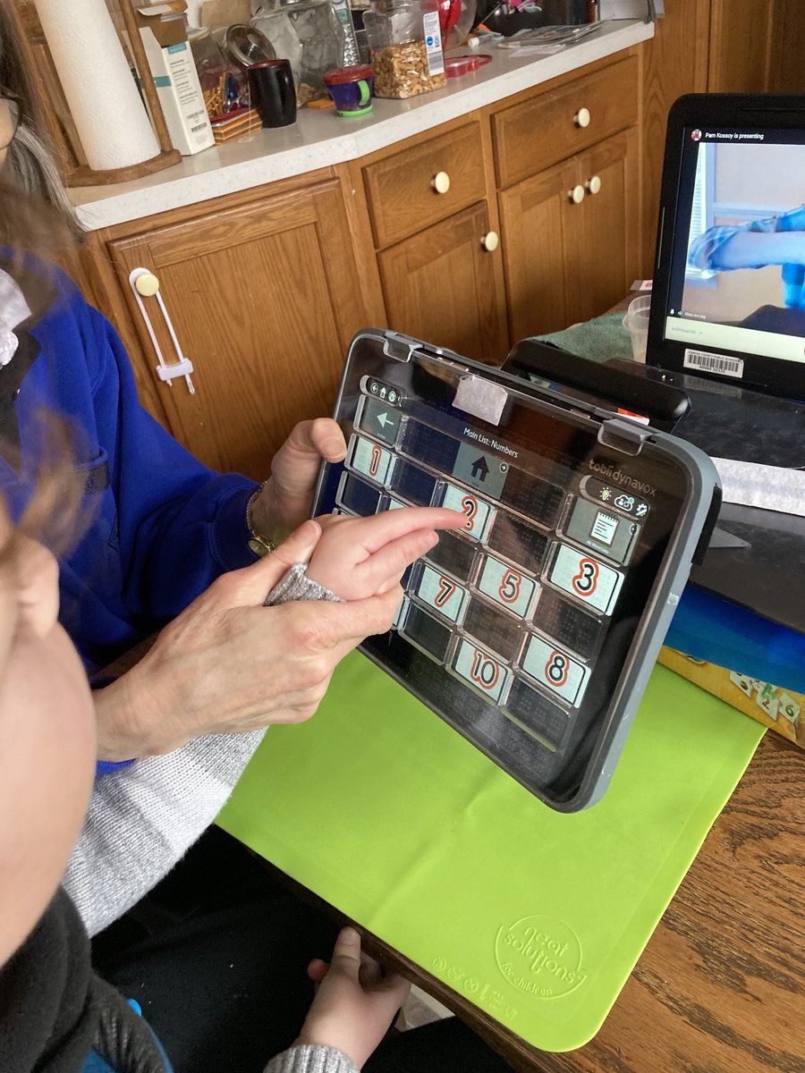 AmbHeffern's tweet image. Grandson using ⁦@TacScreen⁩ on his talker.  Helps finger find the square.