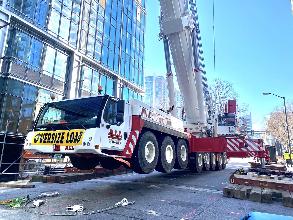 CortezRStafford's tweet photo. Two very large 600 ton and 900 ton mobile cranes have been erected on W. Peachtree St in Midtown Atlanta.  They will be used to safely dismantle the tower crane that suddenly started leaning yesterday at a construction site. #Liebherr https://t.co/tu7ruBIruI