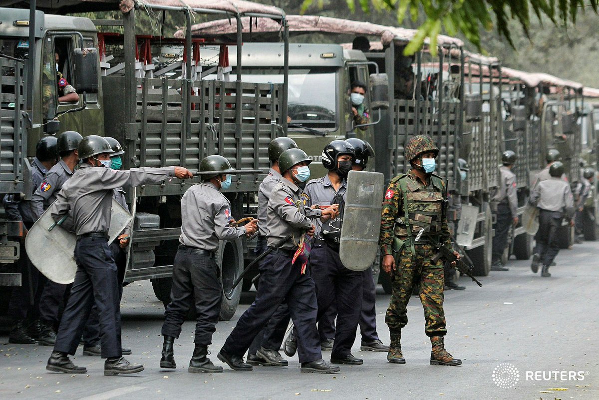 walone4's tweet photo. Police and soldiers are seen during a protests against the military coup, in Mandalay, Myanmar, February 20, 2021. REUTERS/Stringer #WhatsHappeningInMyanmar https://t.co/vLZ60ZySkp