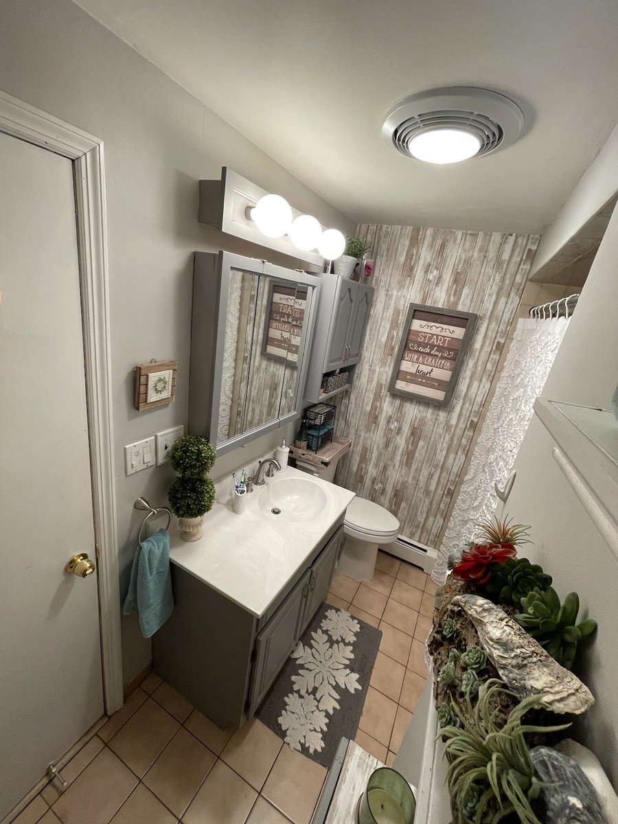 MonarchDesignR1's tweet photo. #Bathroom facelift with a little help from @Benjamin_Moore #shadowgray &amp; #Sweetinnocence. Added an accent wall, updated custom countertop, some new linens and lots of greenery.  🦋🌳🌾🌱🌿
#oldisnew #refinishandreuse #refinished #bathroomrefinish #accentwall #smallroombigresults https://t.co/5EB3LfsGwn