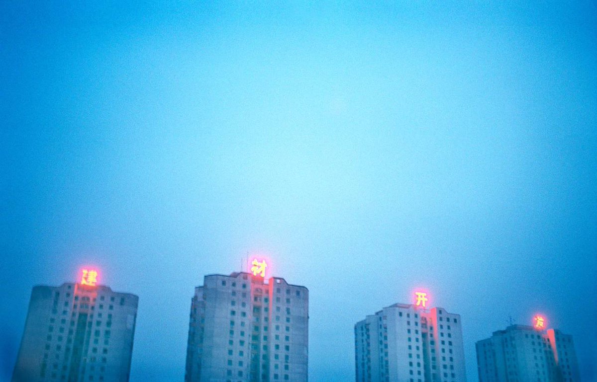 The Art of Album .The skyline in Shanghai, China. The characters on top of the building translate “construction, material, development”.Photo Matthias Clamer.Used by The Killers on their debut studio album 'Hot Fuss', released 2004.