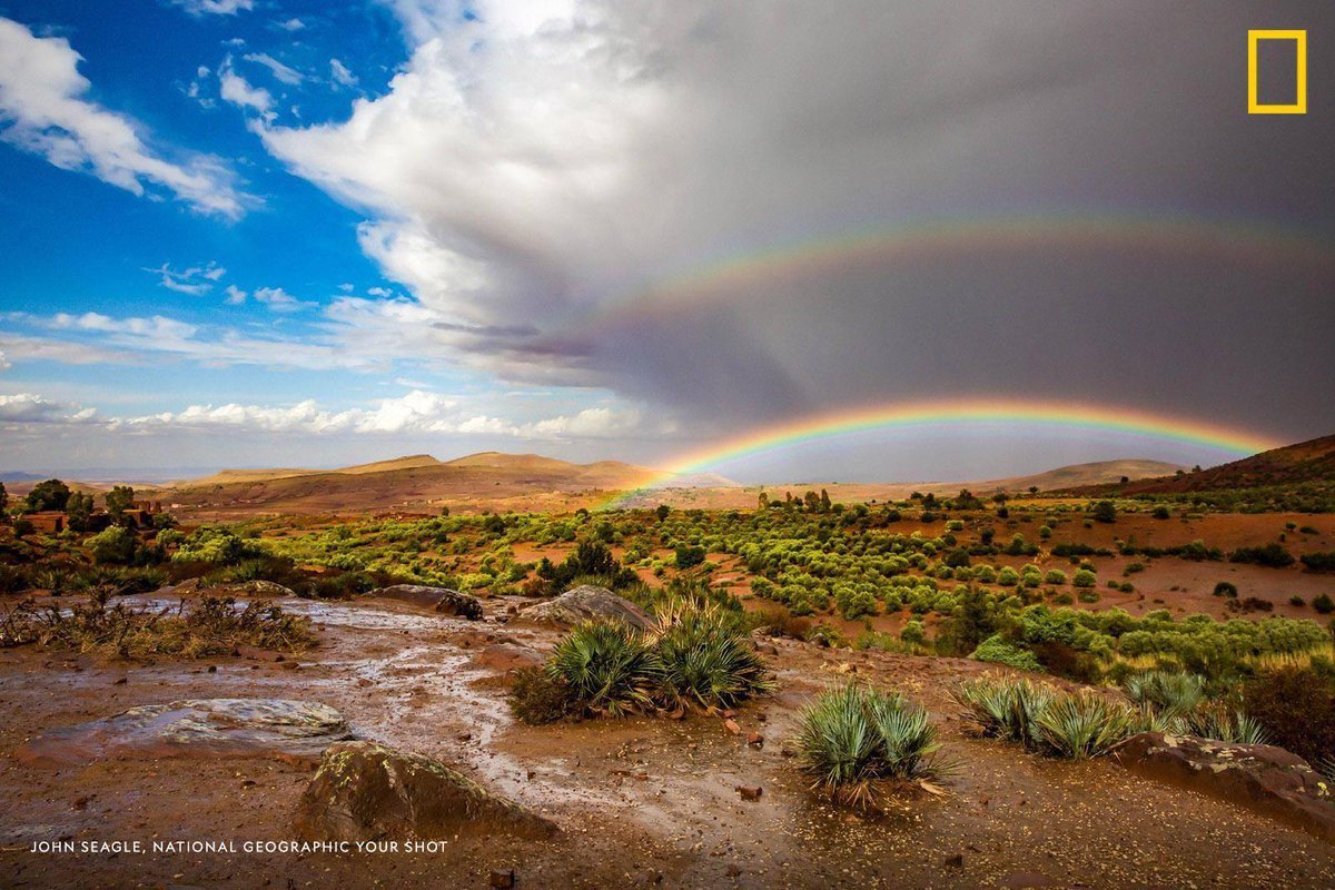 NatGeoTravel's tweet photo. An unexpected rainstorm blessed #YourShot photographer John Seagle with this vibrant double rainbow, captured during a journey through Morocco. https://t.co/424Ama6Ivs