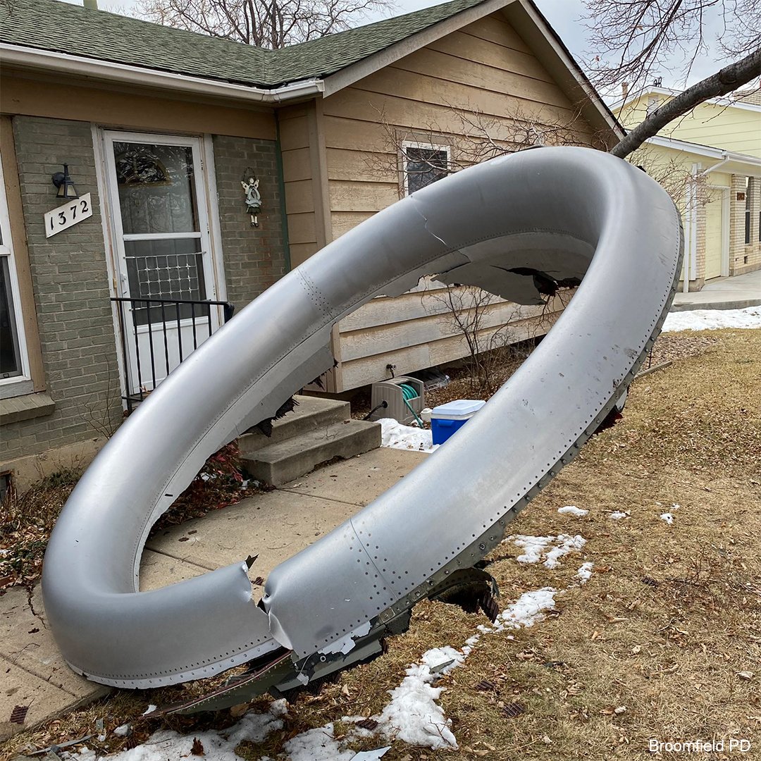 a large metal object in front of a house