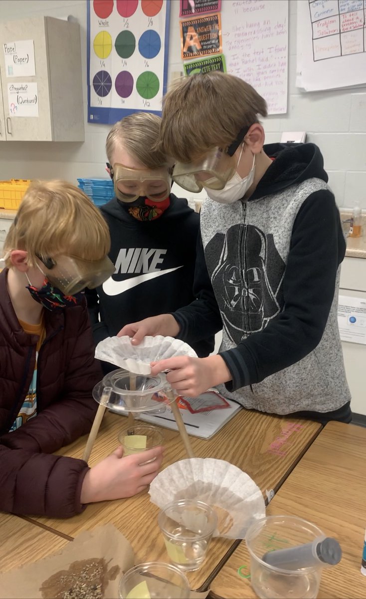 Students in 5G focusing on mixtures and solutions. They were looking at sodium chloride crystals under the microscope and filtering/separating mixtures. 
#nslancers