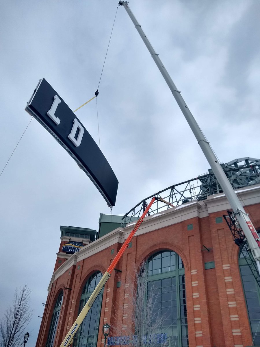Brewers's tweet photo. The 52,000 lbs. American Family Field sign is here! Work is underway to install the new sign on the stadium. https://t.co/ZQYJCgazam