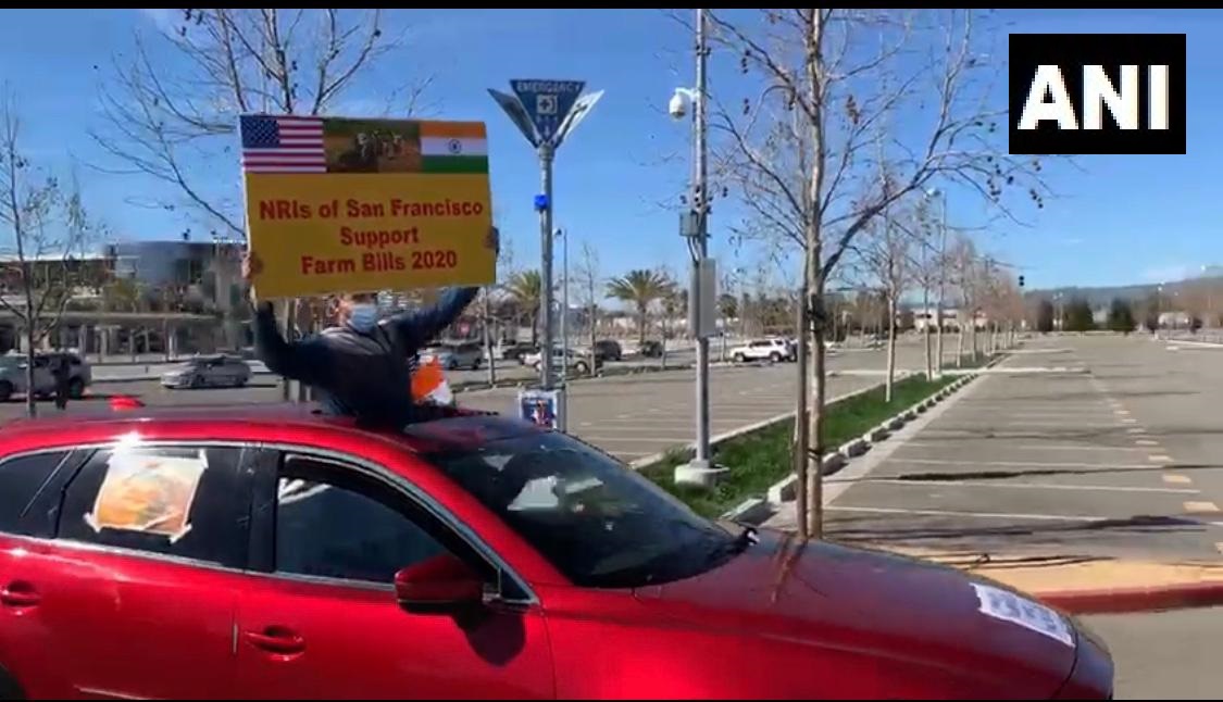 ANI's tweet image. USA: NRIs of the San Francisco Bay Area organised a car rally on 21st February, in support of the Government of India's new Farm Laws