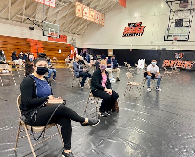 OrangeUnifiedCA's tweet photo. Yesterday, in partnership with CARE Ambulance, Orange Unified vaccinated over 950 educators at an event held in Orange High School’s gym. Thank you to everyone who volunteered to facilitate this event! #COVIDVaccine #OUSDStrong https://t.co/B1hZLiJQ65