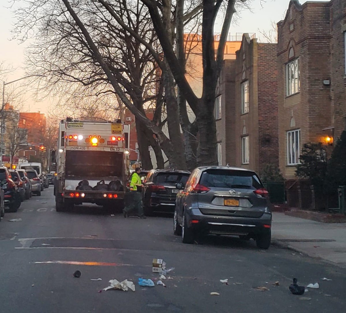 EzraFriedlander's tweet photo. Sanitation often throws the garbage bags carelessly into its trucks creating a massive mess on the streets resulting in FINES against Boro Park residents who are accused of not maintaining clean streets! @NYCSanitation @BrooklynCB12 @SEichenstein @NYSenatorFelder @KalmanYeger RT! https://t.co/AGB3xDtLn3