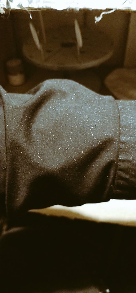 On the plus side, my black shirt has thousands of infinitesimal silver dots upon it that lend it a very subtle glitter. They'll wash out easily enough, but for the moment I feel terribly pretty (the camera really doesn't catch the sparkling at all, but at least you get an idea).