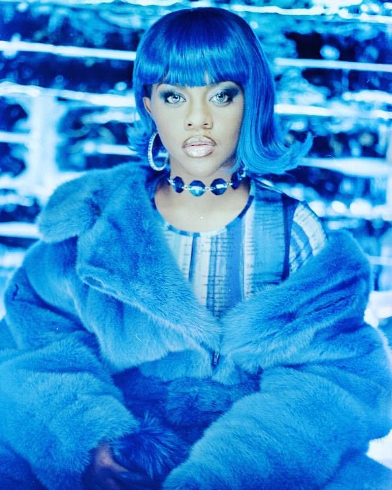 37. Lil' Kim's iconic blue look from the 'Crush On You'...