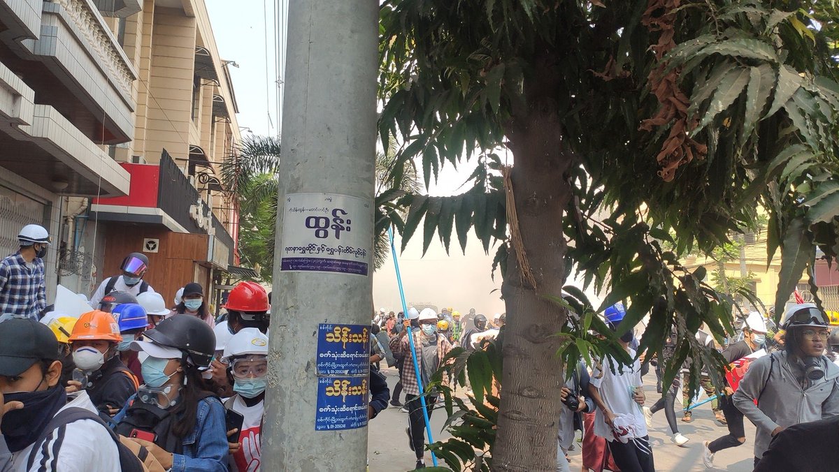 MilkTeaMM_MTAM's tweet photo. Mandalay(22x28 street), sit-in protest is started slaughtered by the Terrorists. Terrorists are shooting with real bullets from inside of Aye-War Teashop and also using sound and tear-gas bombs. One got injured so far.
#WhatsHappeningInMyanmar  
#Mar7Coup #MilkTeaAlliance https://t.co/Z0ALGulAC2