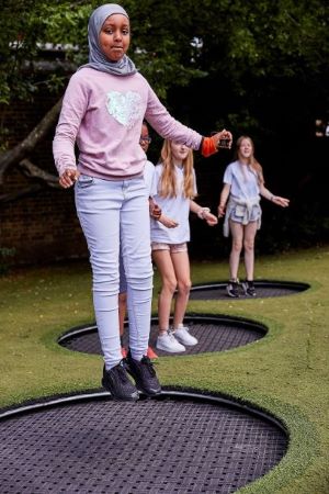 Children jump on trampolines