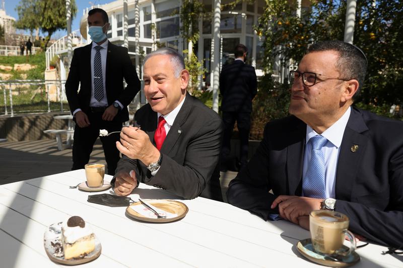 Reuters's tweet photo. We're almost done with COVID curbs, Netanyahu says as Israel reopens restaurants https://t.co/qZeu5G21w7 https://t.co/z32z9wNajS