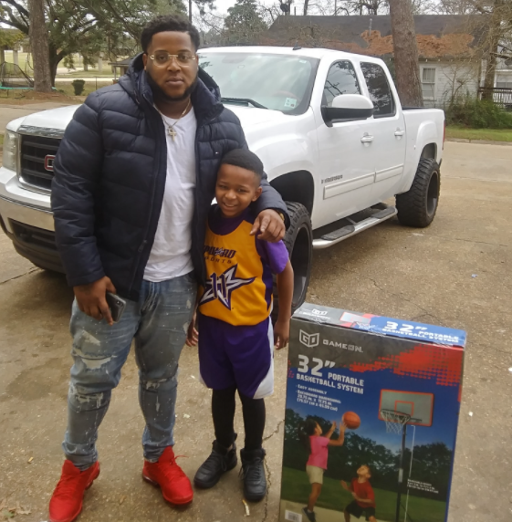 While driving, Devin spotted little Jeremiah playing basketball in his driveway. The 8-year-old was using a trash can as a makeshift basketball hoop. Later on, Jeremiah's grandma, Patricia, opened her door to Devin, who'd returned with a brand new bball hoop for her grandson!