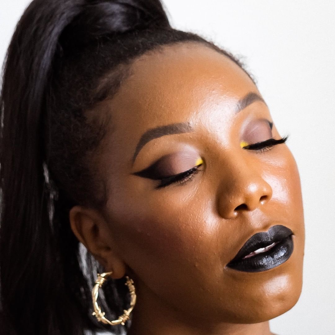 makeitblack's tweet photo. How do you feel about Black lipstick? Let us know below? @vanessa__herring looking 🔥wearing the @maybelline Super Stay Matte Lipstick in Black. #makeitblack #makeitblackchallenge https://t.co/dDBwrhMRd0