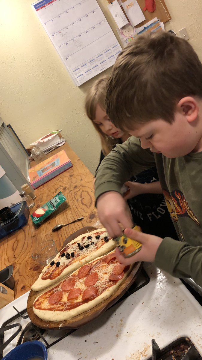 Their master piece pizzas got a little well baked. Oops. They dont mind. Great job kiddos! #AlaskaPets #KidsCook #HomemadeDinner #KidApproved