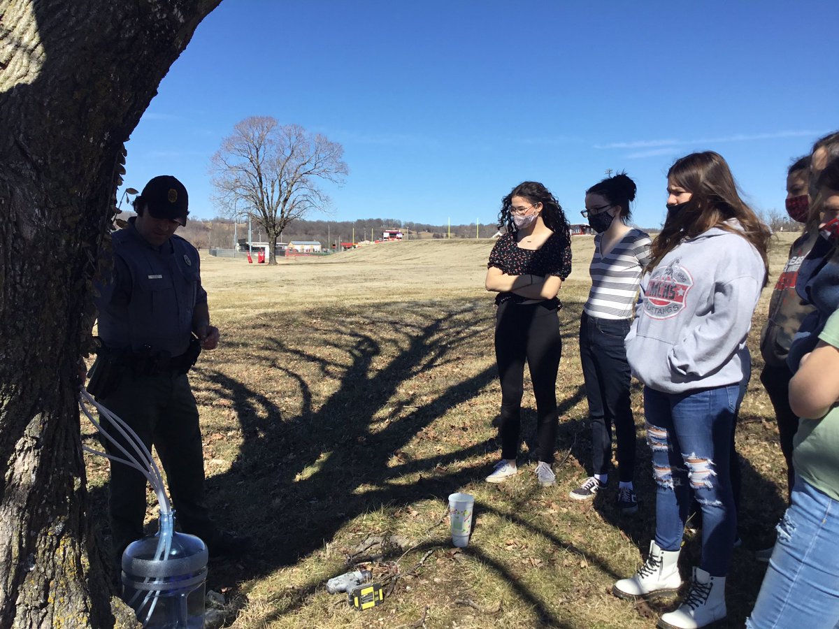 MCR1Mustangs's tweet photo. Students in our advanced cooking classes worked with Agent Strader from the Missouri Conservation Department to learn to tap a maple tree for sap. Stay tuned for more pictures of their progress as they turn the 5 gallons of sap they collected into pure maple syrup! https://t.co/d3rStY8Jrh