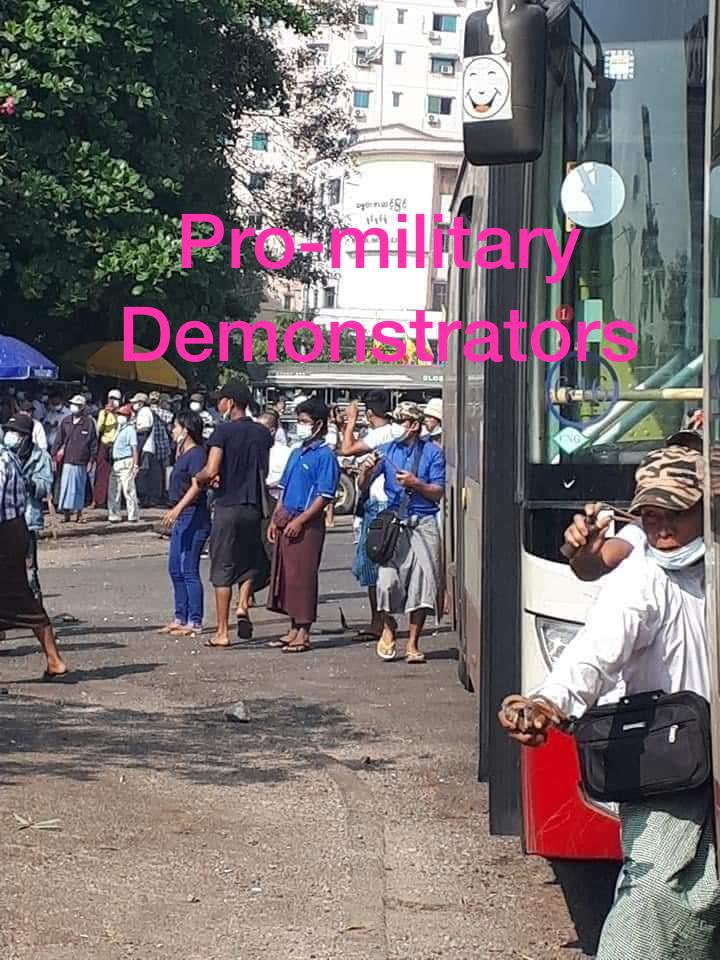 Pro-military supporters (Hiring thugs) attack the peaceful protestors at Sule, Yangon. #WhatsHappeningInMyanmar  #Feb25Coup