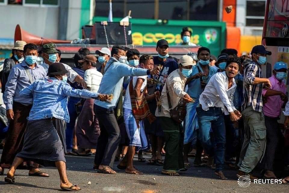 Myanmar military coup supporter (most are daily pay labors)show support on the street in Yangon with holding knife,slingshot and attacking people on the street and also targeting journalist...Now,military is try to plays another game..Be safe everyone..