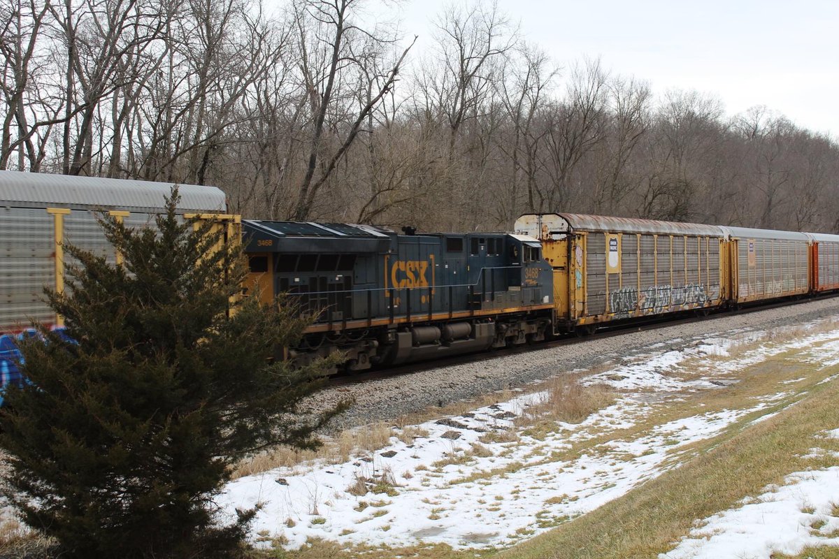 buckeye_and's tweet photo. And here at Taylorsville Metro Park (@MetroParksTweet) we have Q205 rolling by me at the Vandalia siding with a single leader and DPU and some fallen flag Autoracks and interesting graffiti. #railfan #ohiorailfan #vandaliaohio #ohio #csxtransportation #railroad https://t.co/FhwFWr4YIH