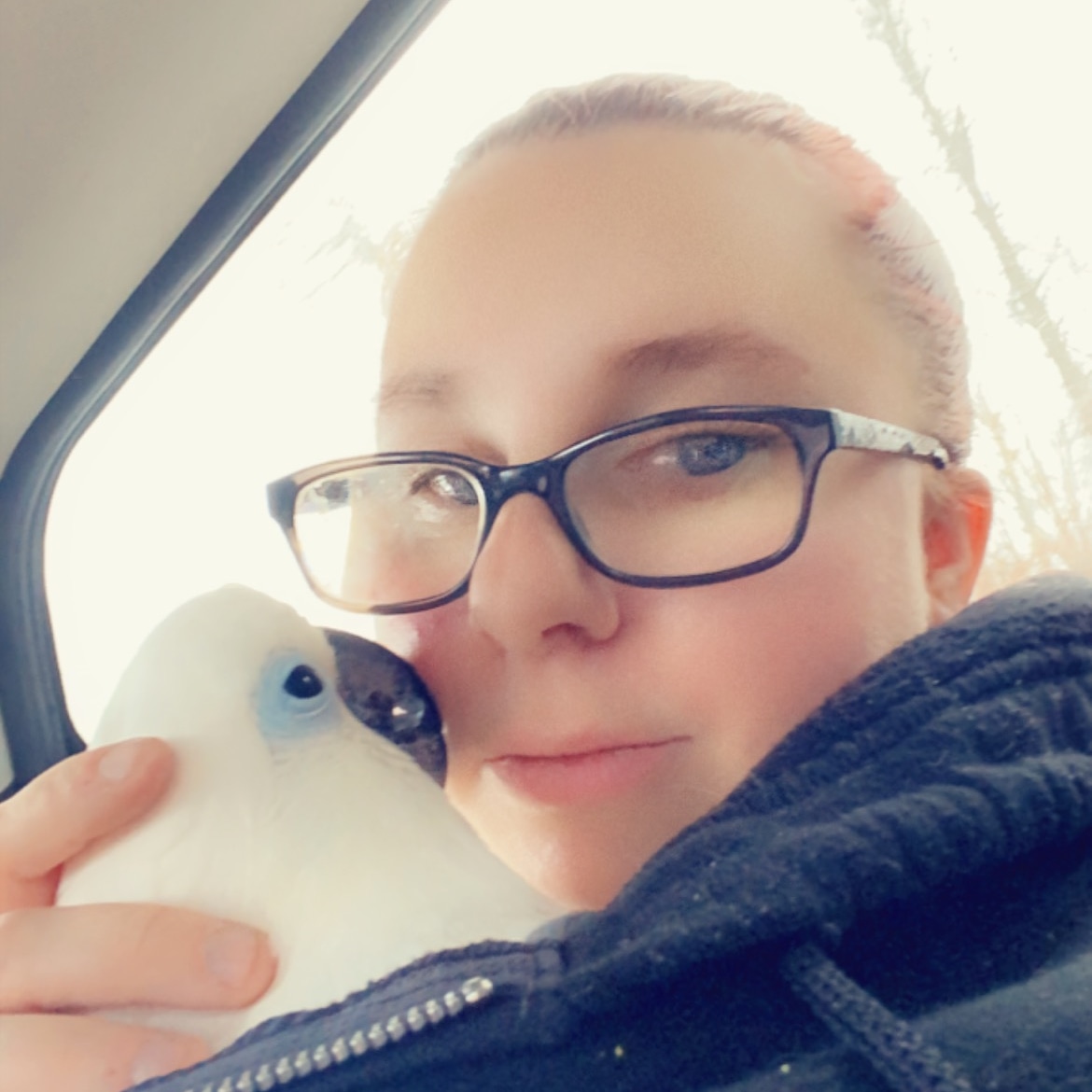 Fred and I are stopping by to say hello! We are on our way to the vet! I'm keeping him calm before he goes back into his cage.