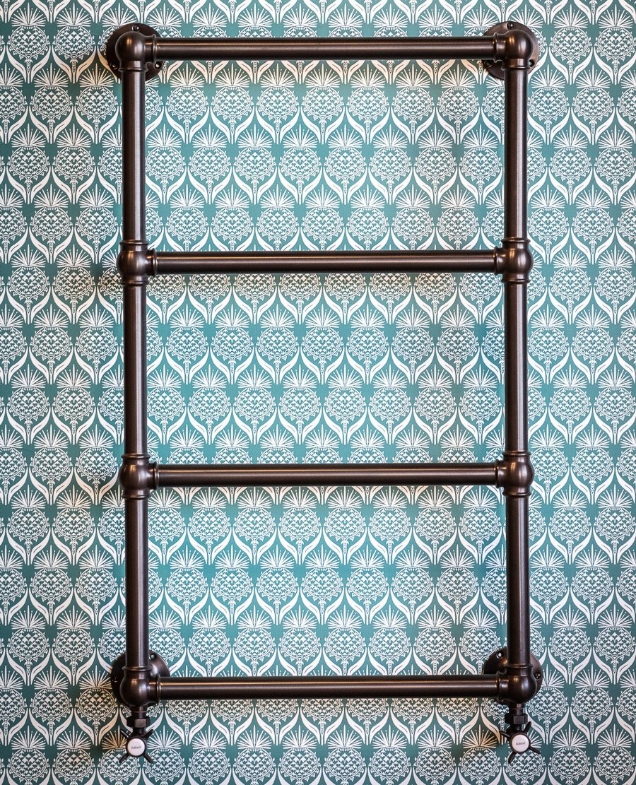 Bronze heated towel rails from Rutland London work so well against a variety of backdrops, notably this beautiful Artichoke Thistle tile from @parksideuk / @barnebygates. 

#interiordesign #interiors #designer #design #instadeco #decor #bathroomaccessories