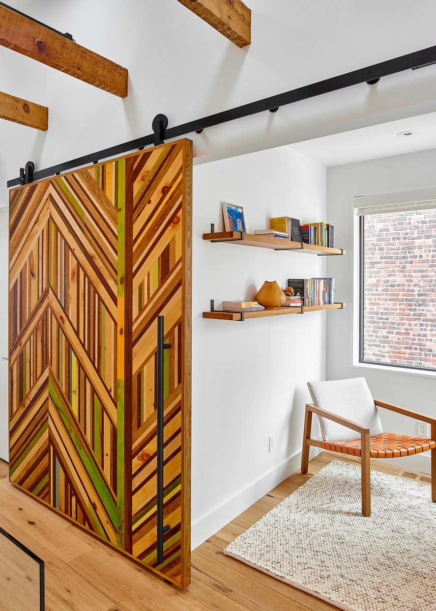M2Contracting's tweet photo. A customized barn door made of repurposed scraps of reclaimed wood from the house makes another bold statement on the 2nd floor, and in the basement, a custom built-in shelving unit again uses reclaimed wood to provide ample storage.
#MSquaredContracting #TorontoGeneralContractor https://t.co/cO7iOUssjV