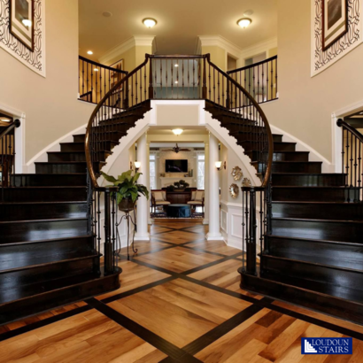 This is a grand entrance! This @TollBrothers home features over the posts, double and single knuckle baluster system. It's a double circular stair with oak treads and risers. #tollbrothers #tollbrothershomes #customstaircase #customstairs #customhomes